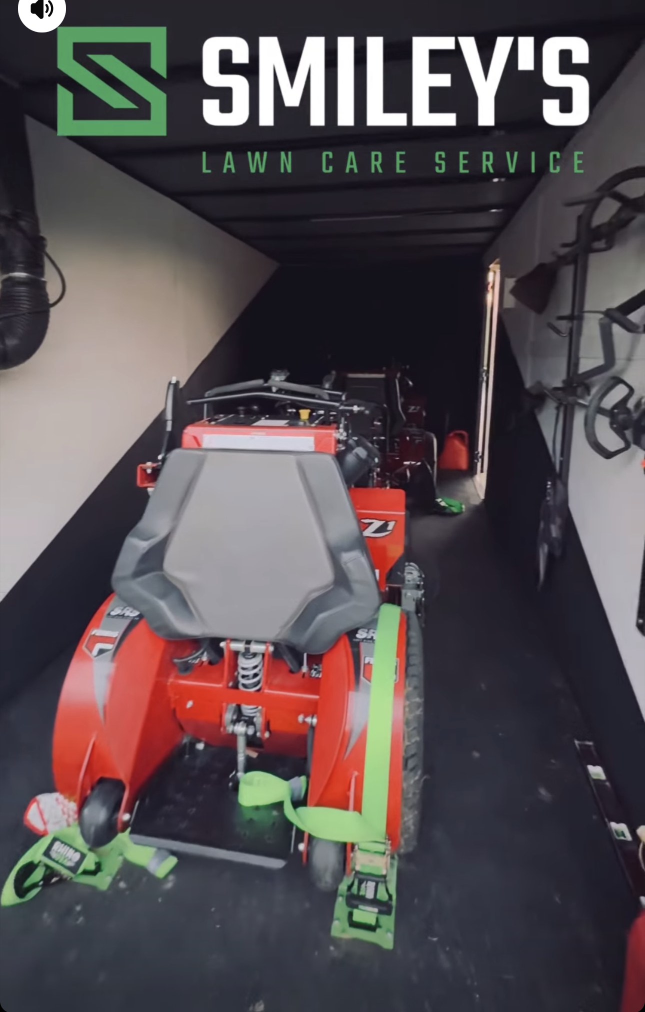 Enclosed Smiley's trailer loaded with the mowers